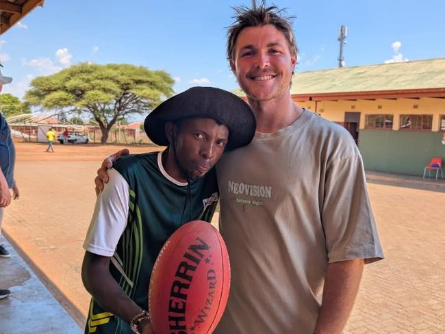 A South African youngster with Harry Benson. Picture: St Mary's Sporting Club