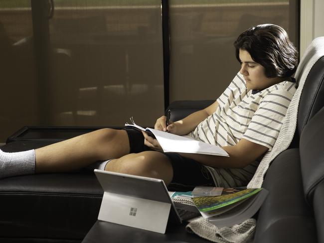 Gabriel Iristov, of the suburb of Reservoir in Melbourne, studying. Picture: Tony Gough