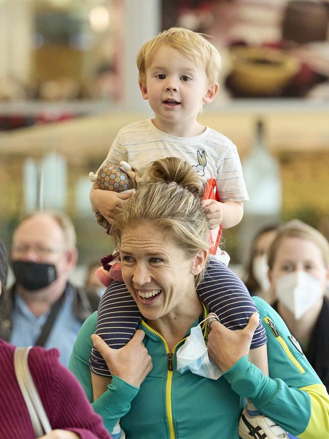 Jess Stenson and her son Billy, 2, arrive at Adelaide Airport after a triumphant Commonwealth Games effort. Picture: Matt Loxton