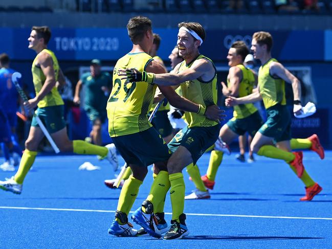 Australia's Tim Brand and Flynn Andrew Ogilvie celebrate after the Kookaburras beat the Netherlands in their quarter-final. Picture: AFP