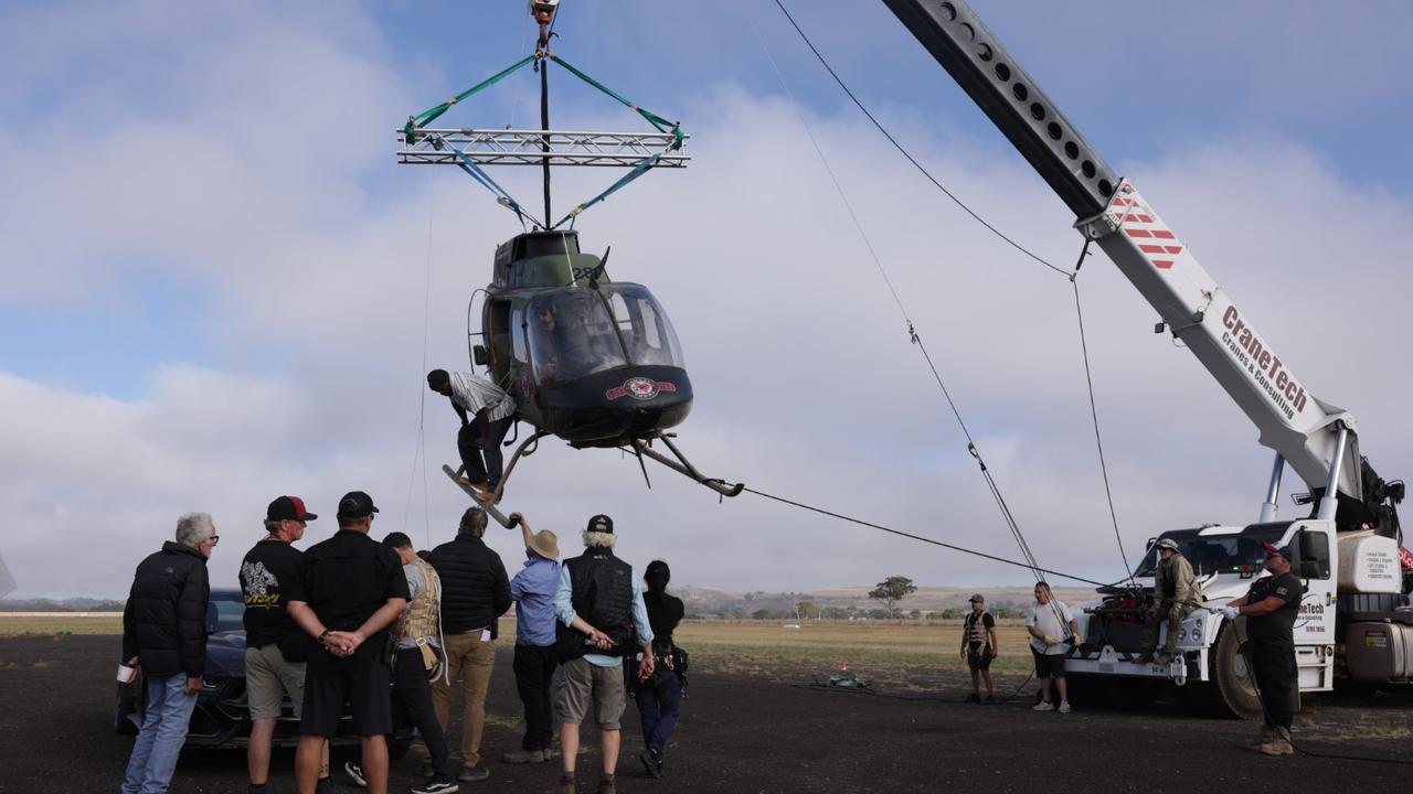 A crane hoists a chopper into position on set at The Mongoose. Video still: Mark Stewart<br/>