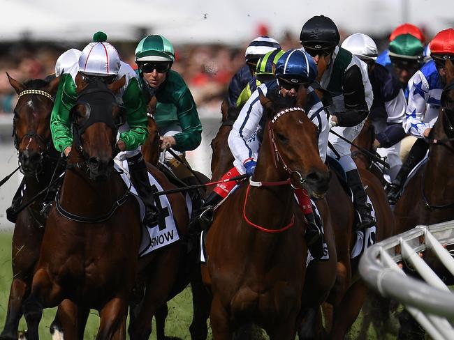 The field gallops into the first turn before Boom Time won the Caulfield Cup at Caulfield racecourse in Melbourne, Saturday, October 21, 2017. (AAP Image/Julian Smith) NO ARCHIVING