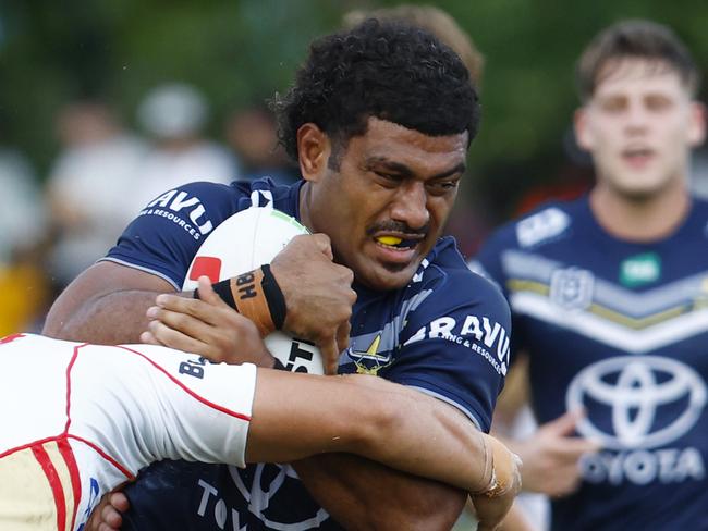 Cowboys' Taniela Sadrugu is tackled in the NRL pre season match between the North Queensland Cowboys and the Redcliffe Dolphins at Barlow Park Picture: Brendan Radke