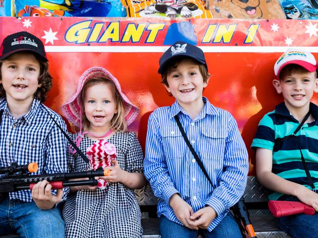 Harry, Pippa and Hugo Hewitt with Will Kenny enjoying the rides and sweet treats of the Clermont Show