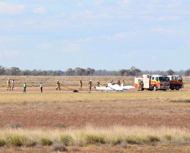 Firefighters at scene of plane fire on side of Landsborough Highway at Longreach Airport. Photo by Greg Weir / CQ Plane Spotting Blog