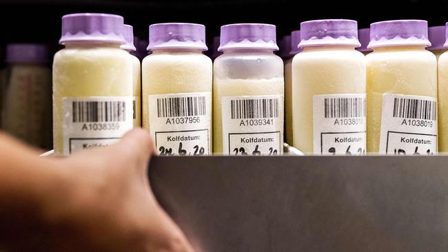 Bottles containing breast milk at a breast milk bank in Amsterdam. Breast milk could be administered as “flavoured ice cubes” to fight the pandemic. Picture: AFP