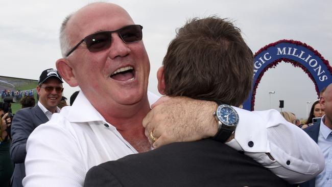 Winner of race 4 Madam Rouge owner Noel Greenhalgh celebrates at the Magic Millions race day at the Gold Coast Turf Club. (Photo/Steve Holland)