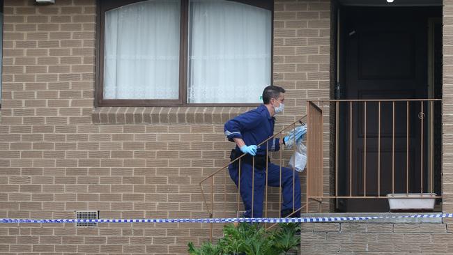 Police investigating at the scene of the stabbing. Picture: David Crosling