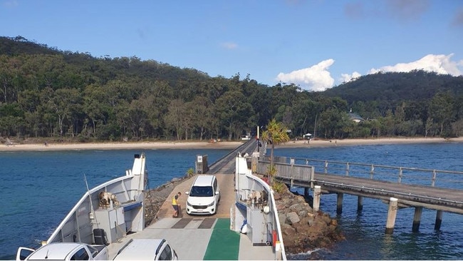 The funeral car driving on to the barge at Fraser Island. Picture: Fraser Coast Chronicle