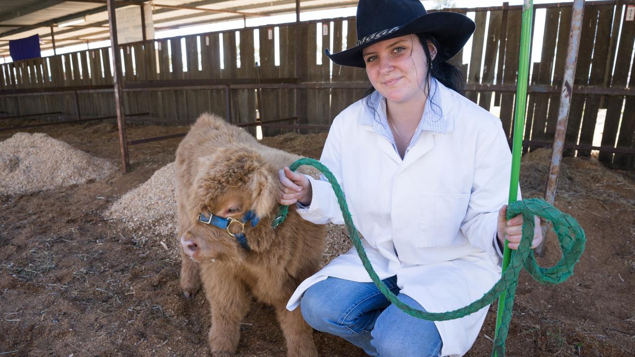 Oakey State High student Shantal Barrow with a six-week old Highland cow at Farm Fest. June 4, 2024. Picture: Christine Schindler