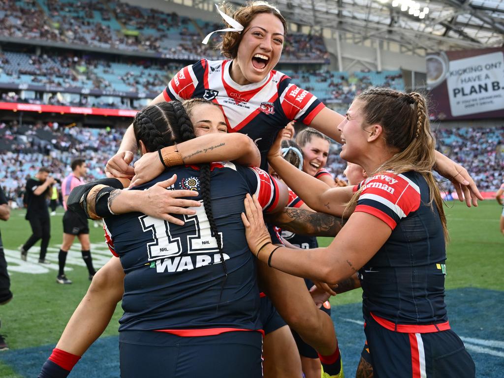 SYDNEY, AUSTRALIA - OCTOBER 06: Roosters players celebrate after winning the NRLW Grand Final match between Sydney Roosters and Cronulla Sharks at Accor Stadium on October 06, 2024, in Sydney, Australia. (Photo by Quinn Rooney/Getty Images)