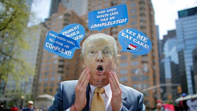 A man wears a mask with the face of Donald Trump, as he takes part in the 100 Days of Failure Protest to mark the first 100 days of the Trump administration on April 29, 2017 in New York. (Pic: AFP/Kena Betancur)