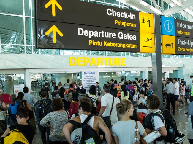 DENPASAR, BALI, INDONESIA - JULY 13:  Foreign tourists arrive at Ngurah Rai International airport departure on July 13, 2015 in Denpasar, Bali, Indonesia. Bali's international airport reopened after being closed due to volcanic ash clouds from Maunt Raung, but Australia's main carriers to the holiday destinations are still not flying. (Photo by Agung Parameswara/Getty Images)