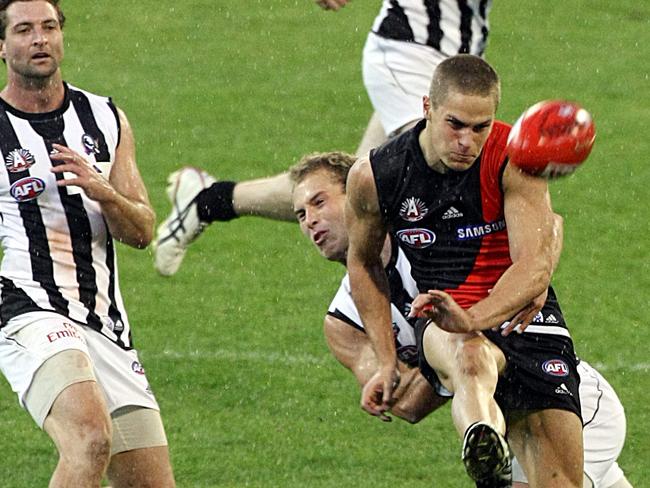 Zaharakis gets his kick away for the winning goal as Brent Macaffer lunges to tackle.