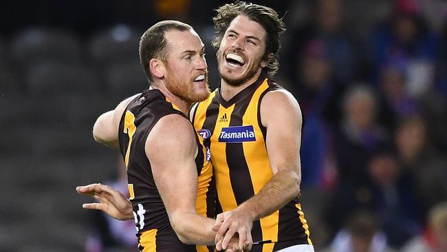 Jarryd Roughead and Isaac Smith celebrate a Hawthorn goal.