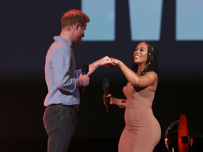 Prince Harry and Nomzamo Mbatha onstage. Picture: Getty Images