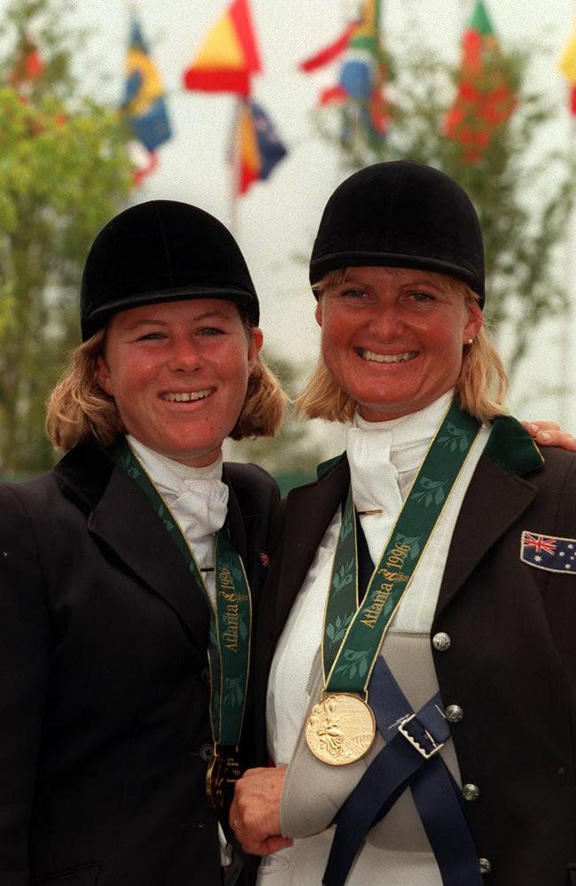 Injured Gillian Rolton, right, with Wendy Schaeffer wearing gold medals at the Atlanta Olympic Games.