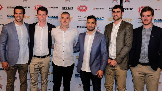 Dustin Martin (third from the left) arrives with Tiger teammates. Picture: AAP