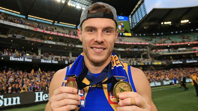 Shuey with his Norm Smith and premiership medals. Picture: Mark Stewart