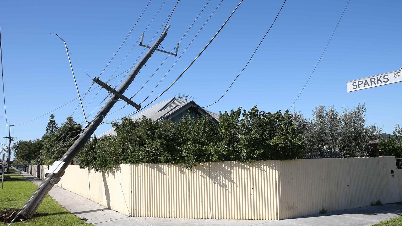 A compromised power pole belonging to Melbourne’s Powercor after a car hit it. Powercor has not said how much of Melbourne’s power is delivered underground. Picture: Peter Ristevski