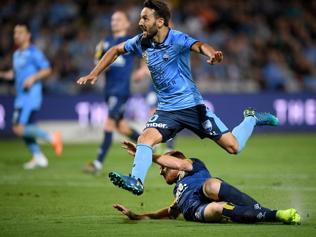 Milos Ninkovic of Sydney is tackled by Ian Zygmunt Gordon of the Mariners during the Round 10 A-League match between the Sydney FC and the Central Coast Mariners at Netstrata Jubilee Stadium in Sydney, Saturday, December 14, 2019. (AAP Image/Dan Himbrechts) NO ARCHIVING, EDITORIAL USE ONLY