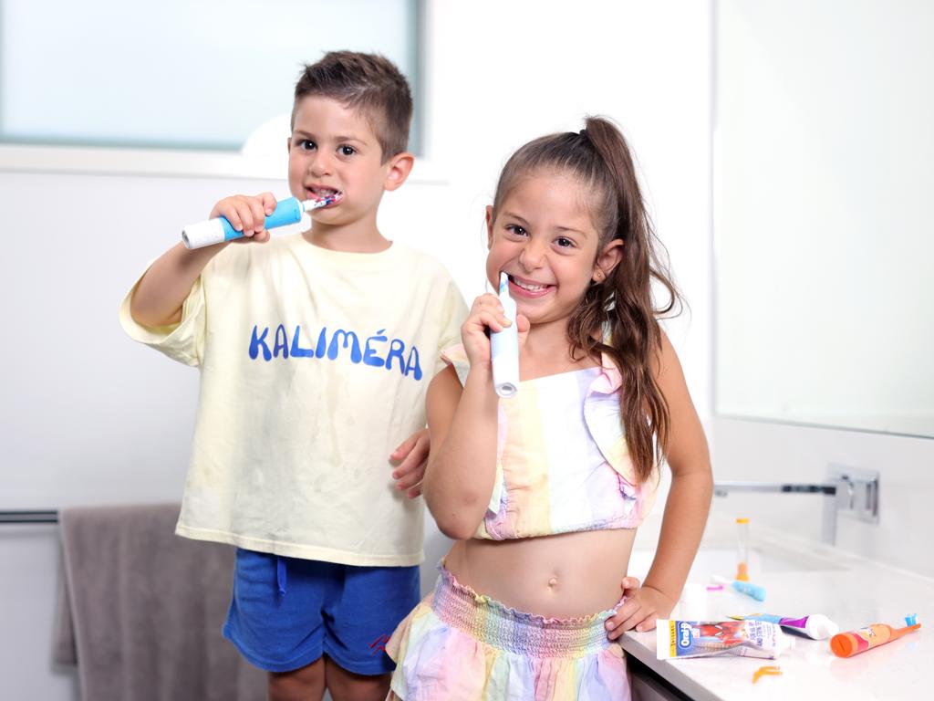 Mary and Christian Kalligeros at home brushing their teeth. Picture: Steve Pohlner