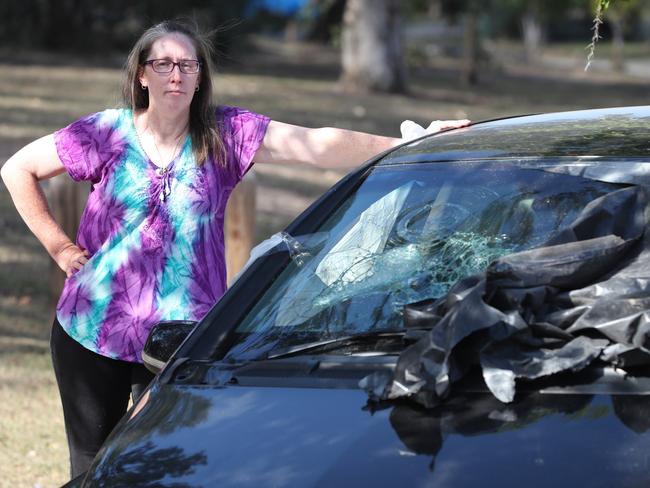 Michelle Rampton woke up Sunday to find an abandoned Merc in her front yard - Police have been unable to do anything and she was forced to tow it from her yard into the street. Picture: Peter Wallis