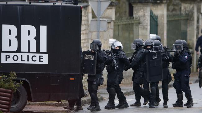 French special intervention police conduct a house-to-house search in Longpont, northeast of Paris, following the Charlie Hebdo shooting. Picture: Reuters