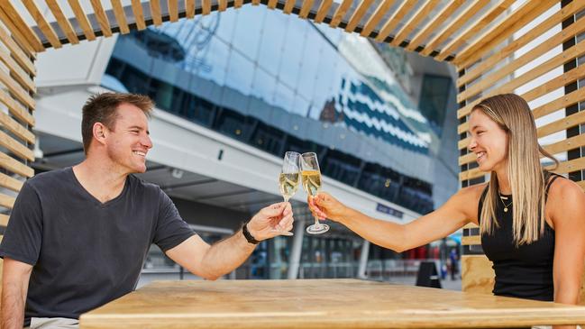 Australian Open dining pods, Eliza Howard and Murray Waterson enjoying champagne. Picture: Tennis Australia/Graham Denholm.