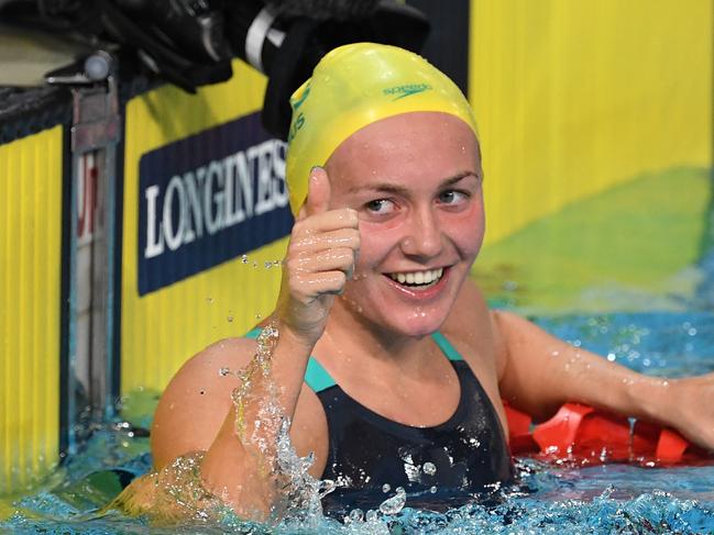 Ariarne Titmus of Australia reacts after winning the Women's 800m Freestyle Final on day five of swimming competition at the XXI Commonwealth Games at Gold Coast Aquatic Centre on the Gold Coast, Australia, Monday, April 9, 2018.  (AAP Image/Dave Hunt) NO ARCHIVING, EDITORIAL USE ONLY