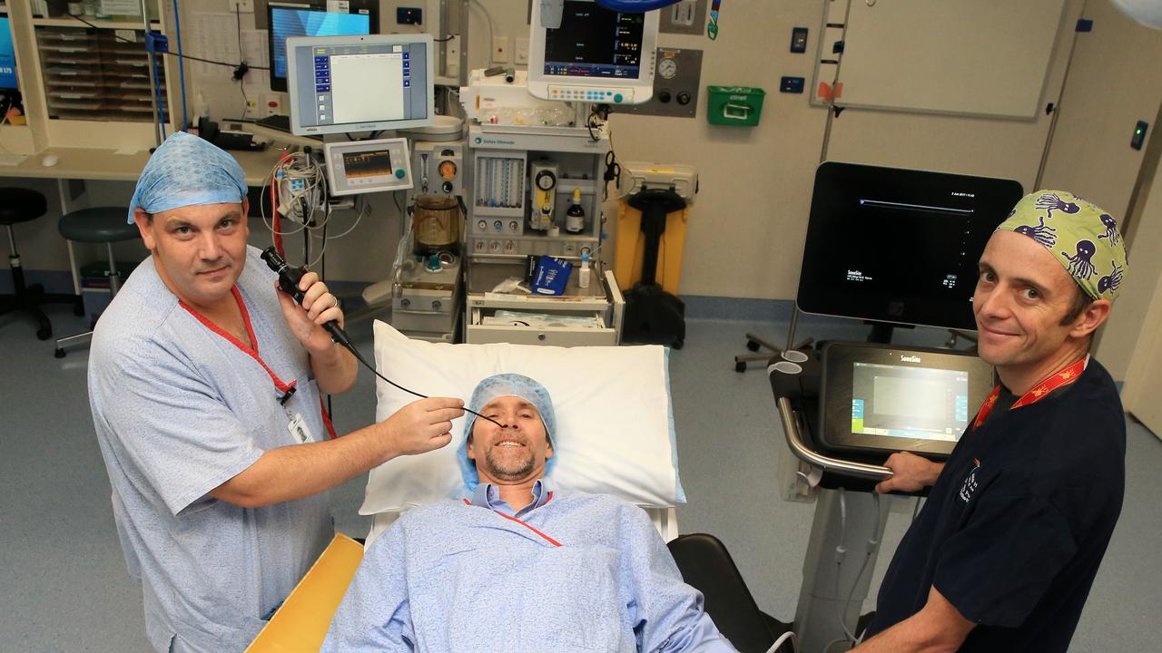 Through his tenure CEO Tony Franz raised $19 million in critical hospital funding. Respiratory Physician Stephen Vincent (left) and Anesthetist Dr Andy Potter (right) try new equipment on then Hospital Foundations CEO Tony Franz (centre). PICTURE: JUSTIN BRIERTY