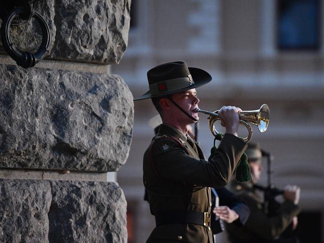 A soldier plays The Last Post at the Adelaide Anzac Day service on North Terrace. Photo: AAP Image/David Mariuz.