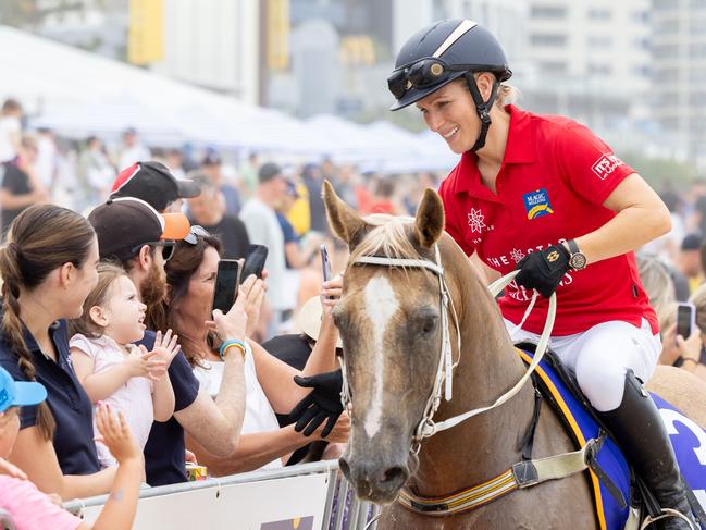 Zara Tindal meets the crowd  at the Magic Millions Barrier Draw and Beach Run. Picture by Luke Marsden.