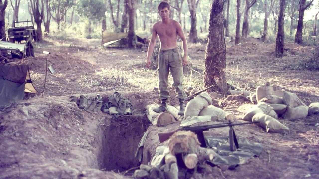 Australian soldier Richard Barron stands near his pit at Fire Support Base Coral, during the Battle of Coral-Balmoral during the Vietnam War.