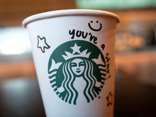 CHICAGO, ILLINOIS - FEBRUARY 25: Coffee is served at a Starbucks coffeeshop on February 25, 2025 in Chicago, Illinois. Starbucks announced in an email made public yesterday that it will cut 1,100 jobs companywide and eliminate from its menu several drinks to speed customer service.   Scott Olson/Getty Images/AFP (Photo by SCOTT OLSON / GETTY IMAGES NORTH AMERICA / Getty Images via AFP)