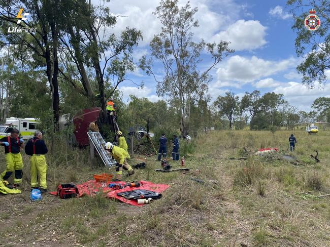 Fireys have worked for more than two hours to free a truck driver man left trapped by a tree following a serious two-vehicle head-on crash at the Carmans Rd and Bruce Highway intersection at Monduran. Photo: Lifeflight