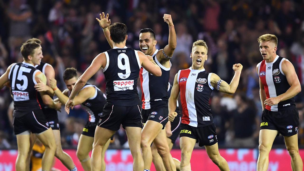 The Saints celebrate after beating Hawthorn at Marvel Stadium on Sunday.