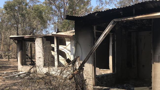 Burnt out remains of a home next to the custard apple orchards on Byfield Rd