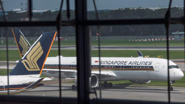 A Singapore Airlines passenger jet taxis along the tarmac as it arrives at Changi International Airport terminal in Singapore on June 8, 2020, as Singapore prepares to reopen its borders after shutting them to curb the spread of the COVID-19 novel coronavirus. (Photo by Roslan RAHMAN / AFP)