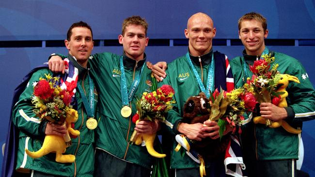 Wiliam Kirby, Todd Pearson, Michael Klim and Ian Thorpe of Australia celebrates after winning gold and setting a new world record in the Men's 4x200m Relay Final held at the Sydney International Aquatic