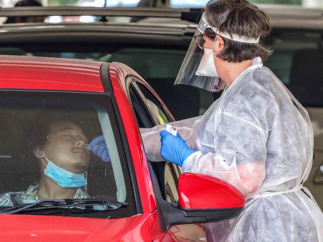 MELBOURNE, AUSTRALIA - NewsWire Photos 17 DECEMBER 2021 : A man has a covid test at the Albert Park testing site. Picture : NCA NewsWire / Ian Currie