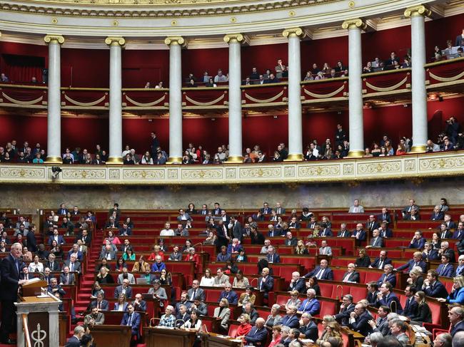 French Prime Minister Michel Barnier (L) delivers a speech during the debate prior to the no-confidence votes on his administration at the National Assembly in Paris on December 4. Picture: AFP