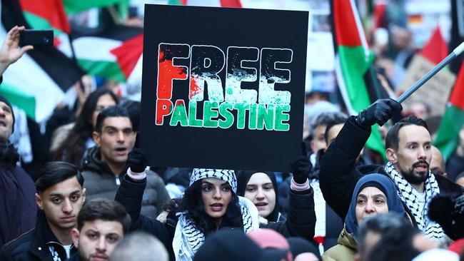 A demonstrator holds up a sign reading “Free Palestine” during a rally in solidarity with Palestinians.