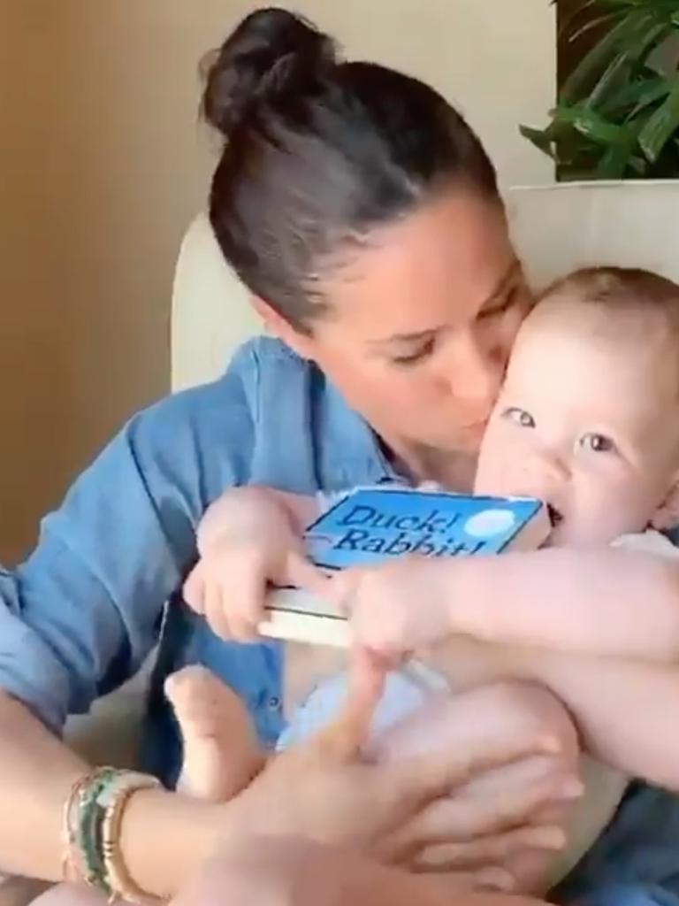 Meghan Markle reading a book to son Archie on the occasion of his first birthday.