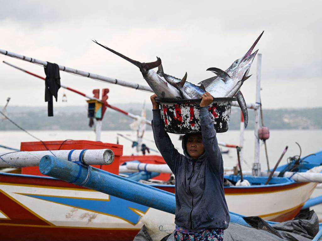 Kedonganan is known for its black sand and fishing boats. Picture: AFP