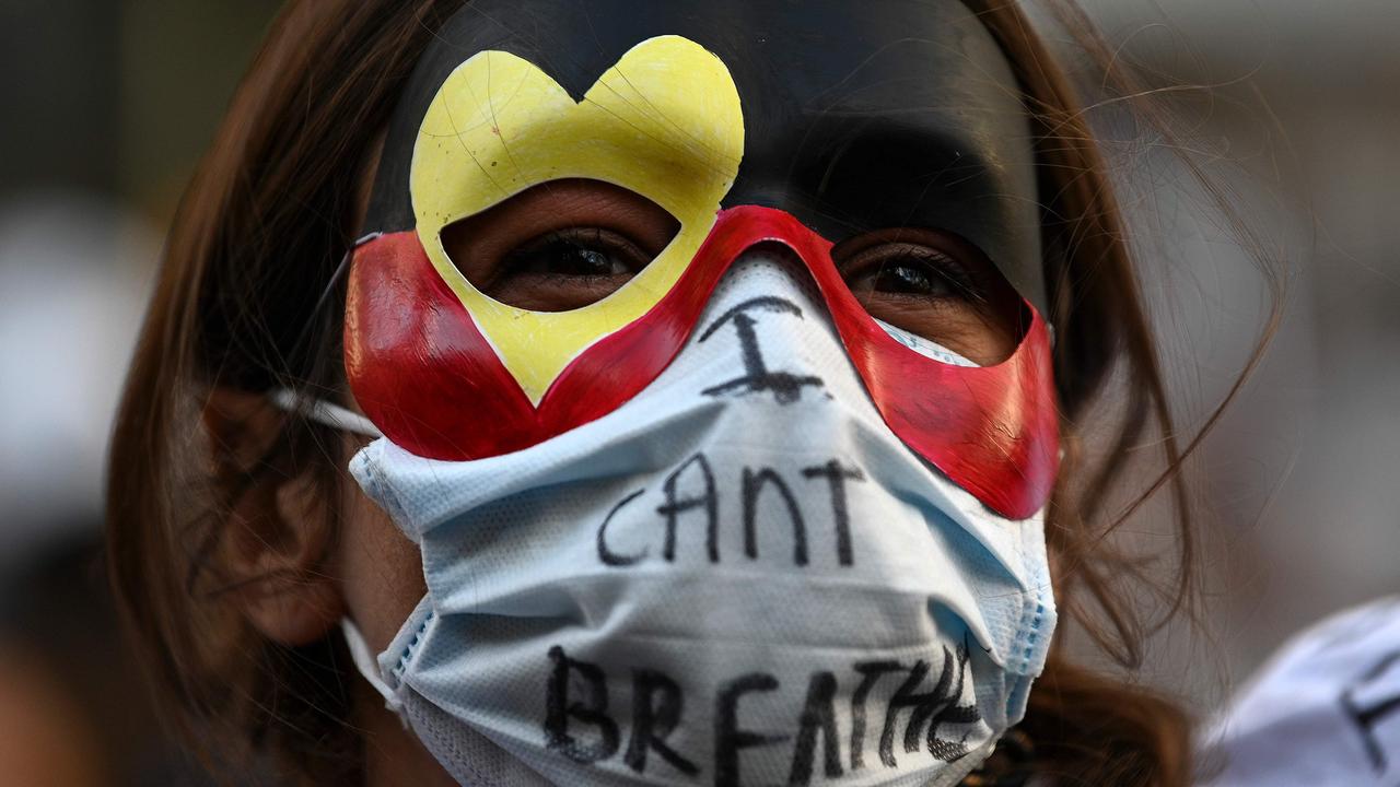 A demonstrators attends a Black Lives Matter protest to express solidarity with US protesters and demand an end to frequent Aboriginal deaths in custody in Australia in Sydney. Picture: Saeed Khan/AFP