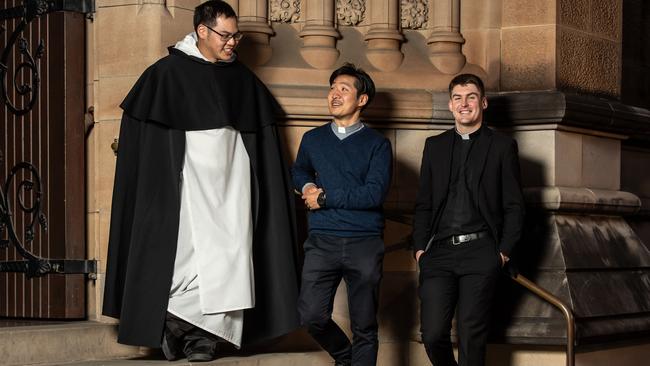 John Jang (centre) with priests William Loh and Joseph Murphy. Picture: Monique Harmer