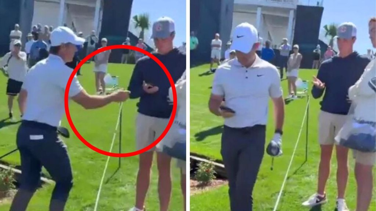 Bizarre moment golf star grabs fan’s phone