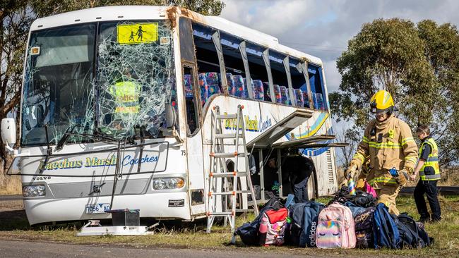 Crash scene investigators continue their investigation while emergency services pick up school bags from the scene in Eynesbury. Picture: Jake Nowakowski