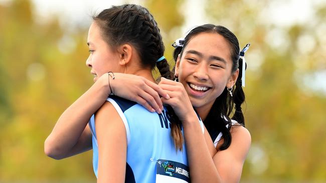 Elysse Diep (NSW) is congratulated by Ariela Sprague (VIC) after the Girls U14 100m